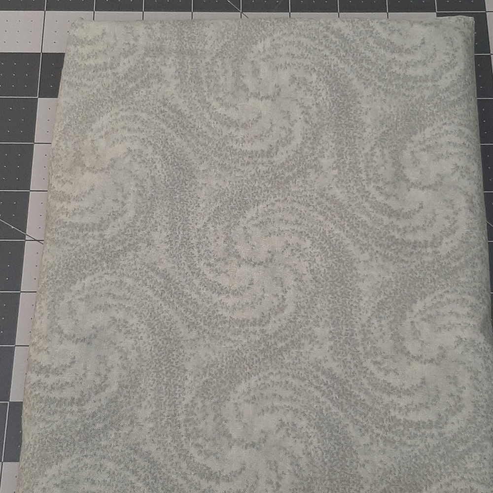 Mint green fabric with swirls